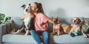 lady with her dogs on her couch