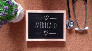 chalk board with the word Medicaid written on it